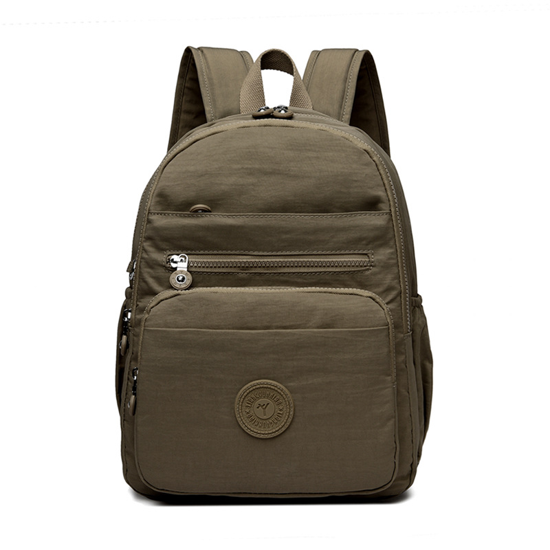 Mochila de hombro de comercio exterior 2025, nueva mochila de computadora simple de color sólido, mochila de escuela secundaria, mochila para hombres y mujeres.