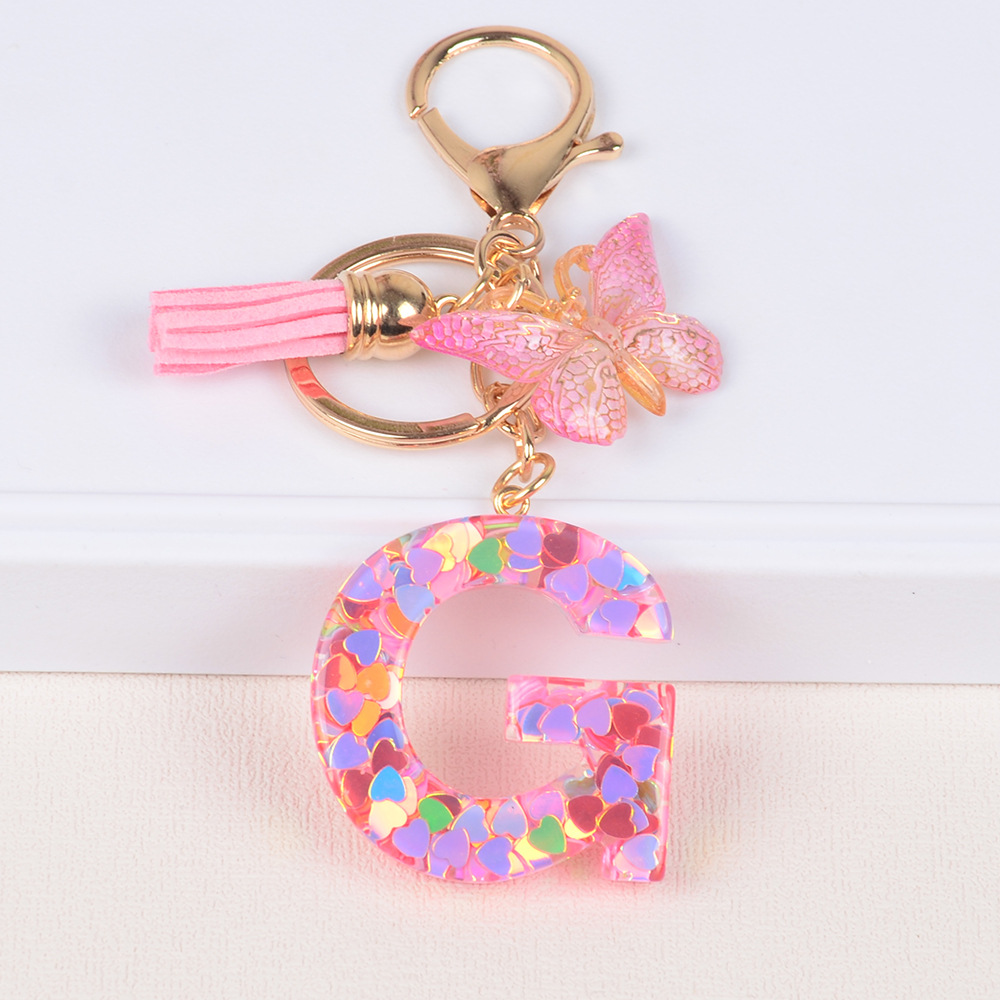 Explosiones transfronterizas amor sequillas iniciales llavero al por mayor resina letra mariposa fringe llavero se puede personalizar