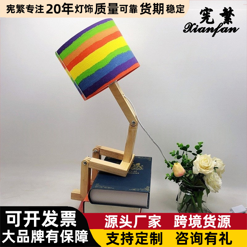Robot creativo transfronterizo plegable dormitorio habitación escritorio lámpara de mesa decorativa tela de madera forma variable lámpara personalizada