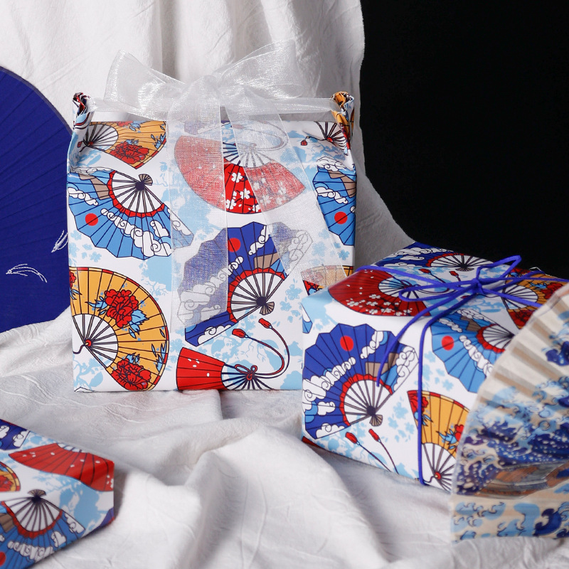 Nuevo ventilador estilo nacional papel de regalo de dibujos animados patrón azul DIY regalo papel de regalo al por mayor
