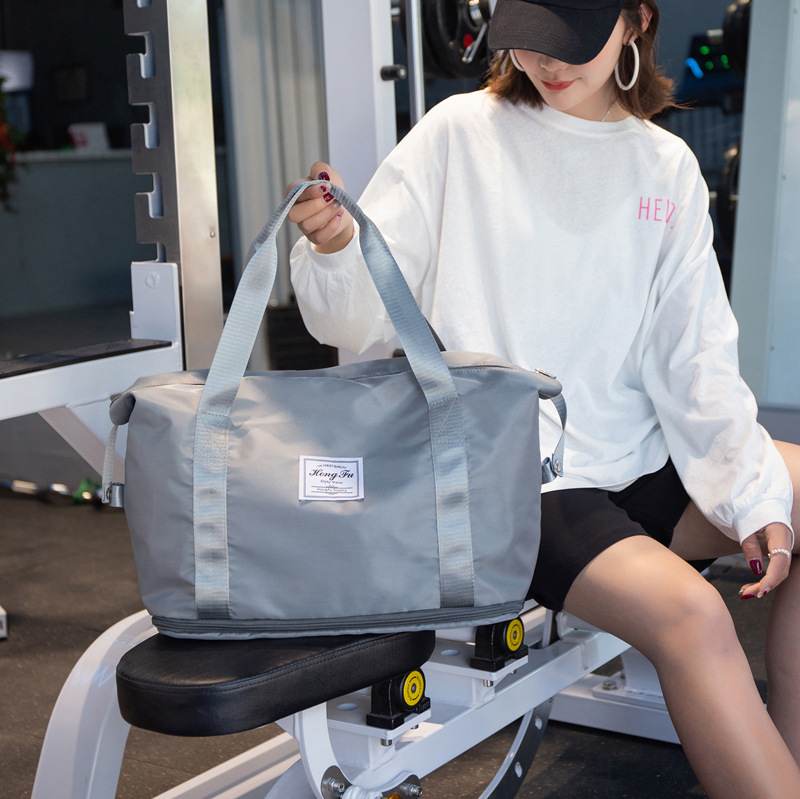 Bolsa de viaje de corta distancia portátil de gran capacidad bolsa de equipaje impermeable de moda para mujer bolsa de embarque de almacenamiento de viaje para hombres