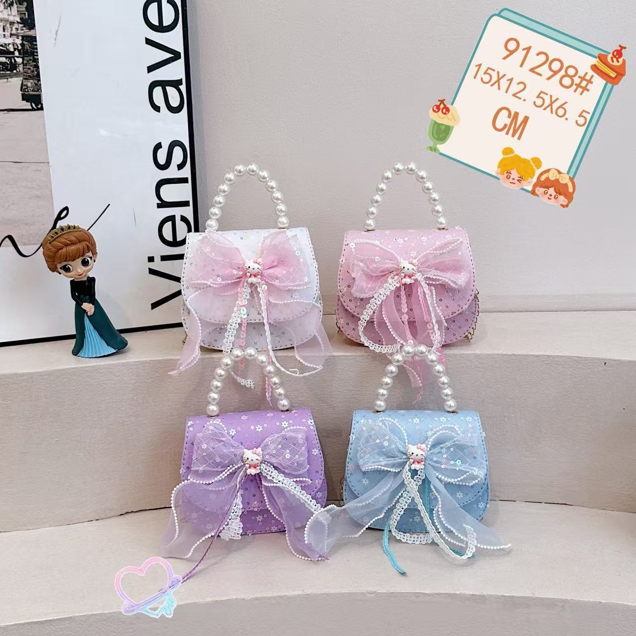 Nuevo comercio exterior pequeña fragancia niñas hombro mochila de moda perla arco bolsos de niños bolsos de cambio de dibujos animados