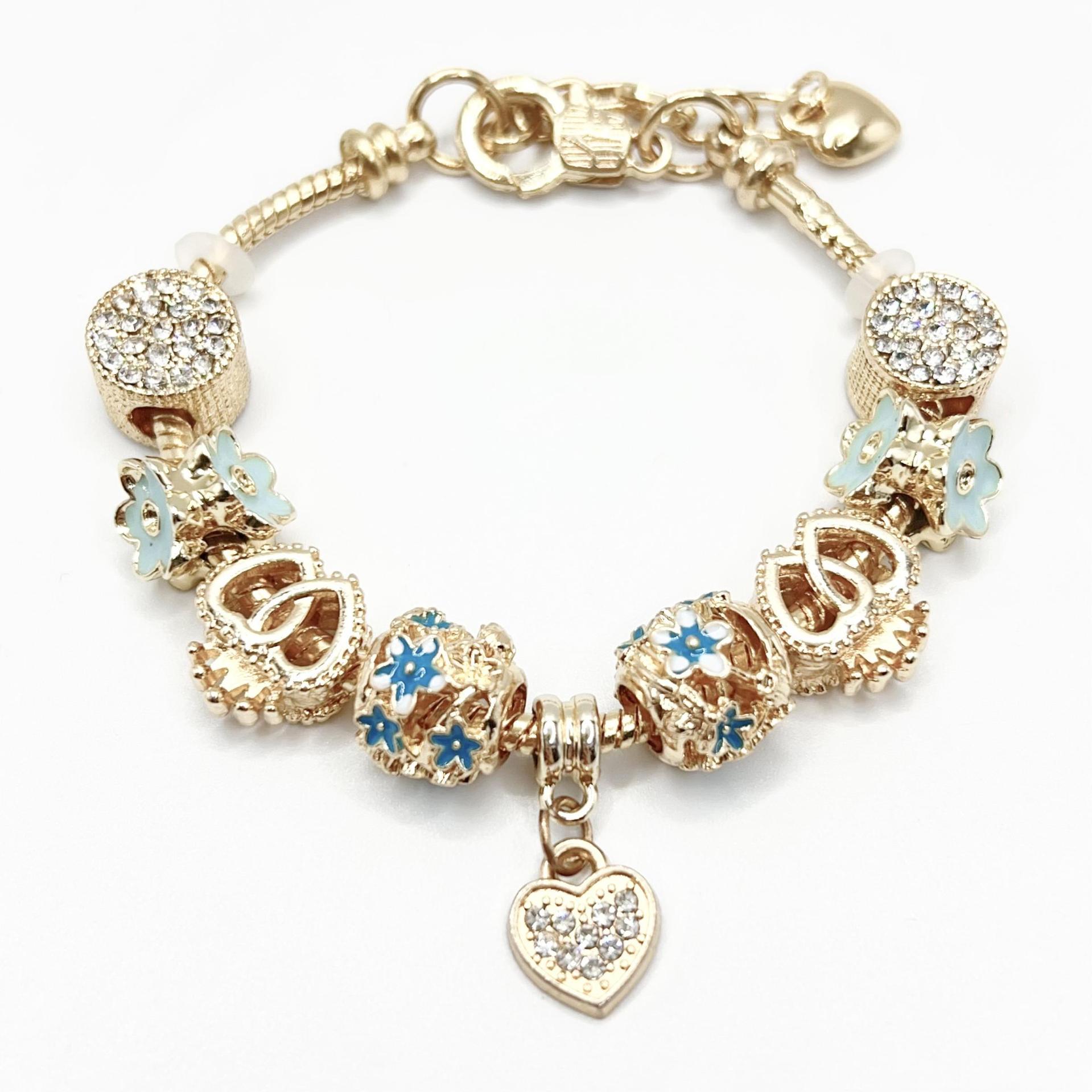 春夏の新型の小清新で甘い少女風のストライプの花の愛の蝶の数珠のブレスレットの透かし彫りのダイヤモンドの手の串