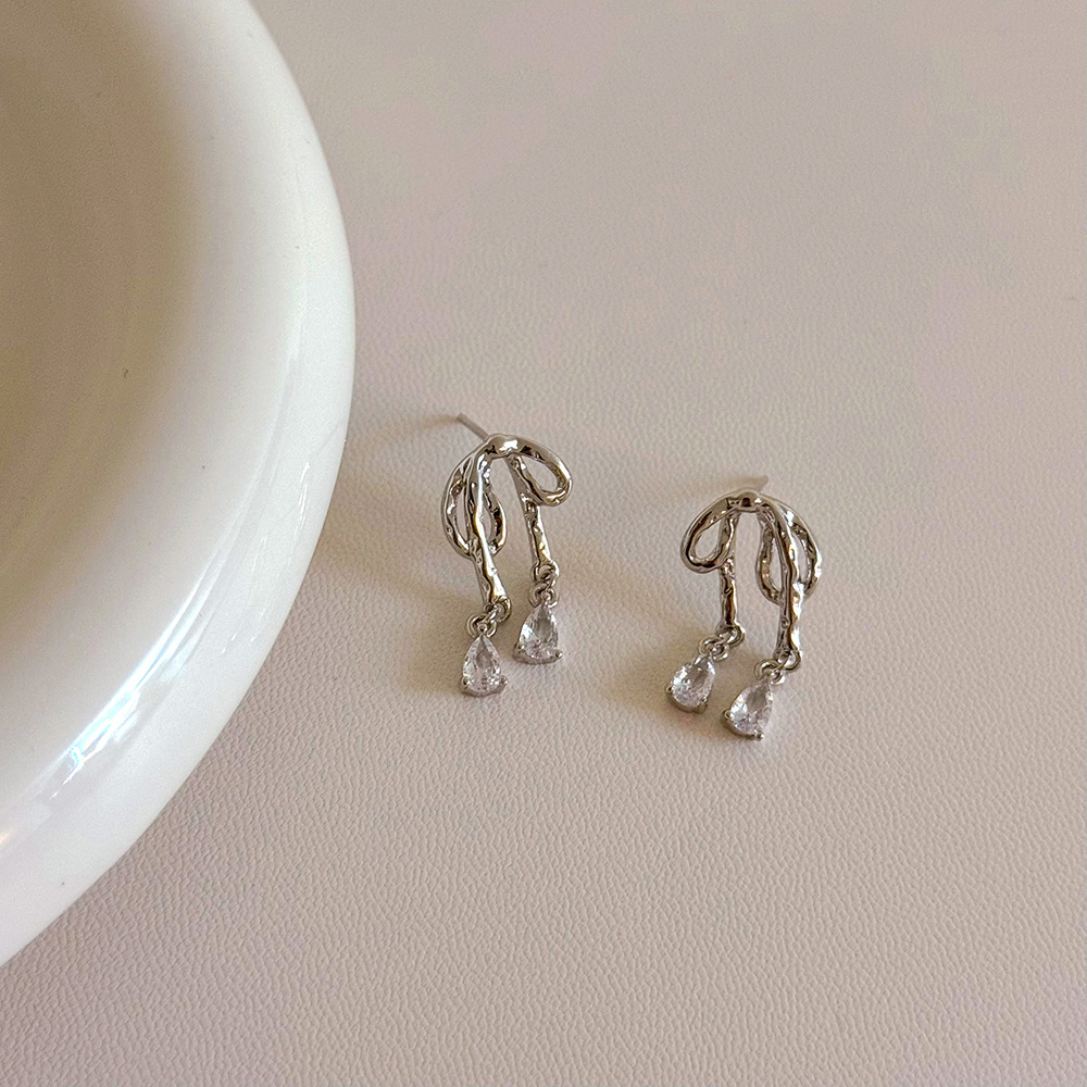 Cute elegant earrings with bow with zircon