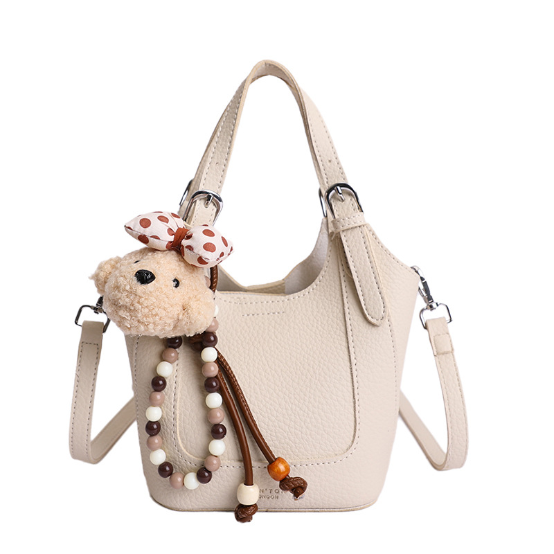 2026 nueva moda versátil cesta de verduras portátil bolso de cubo de agua de alta calidad litchi patrón ligero bolso de lujo bolso de mochila