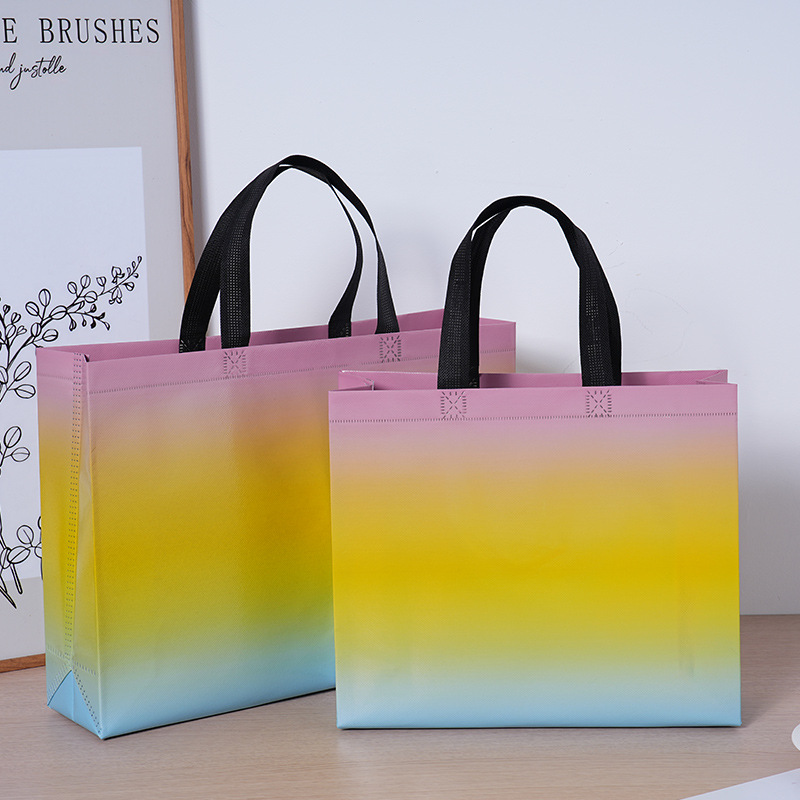 Bolsas de tela no tejida con película láser de tres colores de alta calidad, bolsas para hombres y mujeres de alto valor, grosor personalizado LOGO