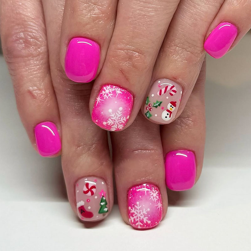 Short square-shaped Christmas pink nails with Christmas tree, snowman, candy, and snowflake designs, fake nails for autumn and winter wear