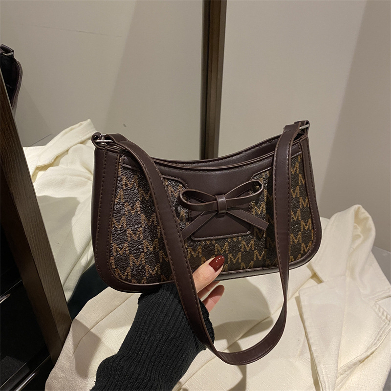 2025 primavera nuevo estilo simple ocio retro bolso de brazo bolso de moda de mujer bolso de nicho coreano bolso de hombro