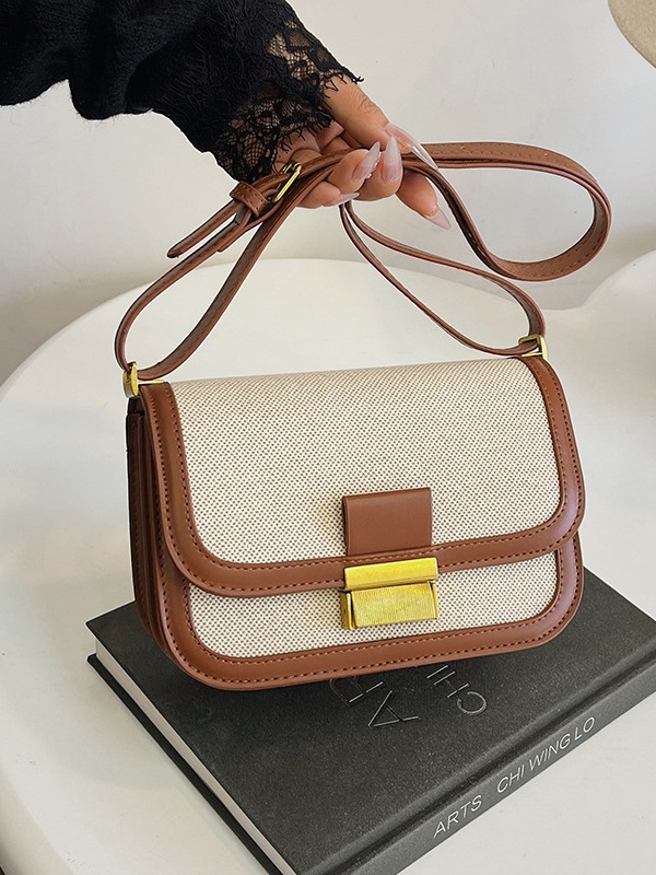 Alta sensación retro bolso pequeño para mujeres 2025 nueva moda transfronteriza color contrastante empalme viaje mochila de hombro