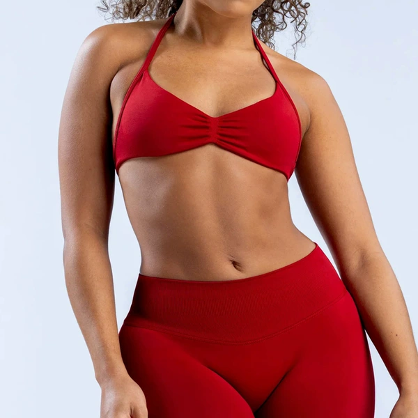 Bra, burgundy trousers, lifting effect
