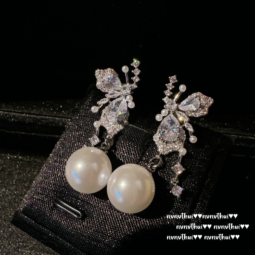 Asymmetrical artificial earrings with zircon