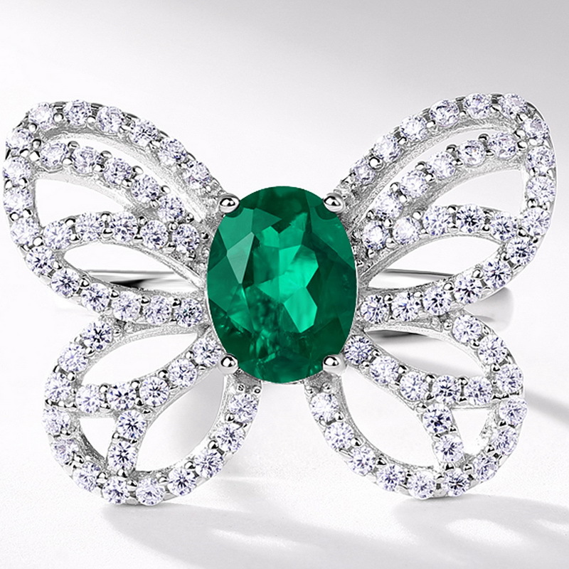 Exclusivo transfronterizo para el cultivo de mariposas Anillo de esmeralda Mujer S925 Cultivo con incrustaciones de plata
