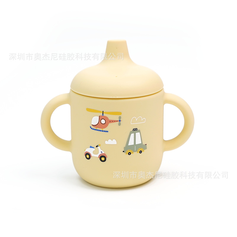 Taza de aprendizaje para bebés de silicona de grado alimenticio - 180 ml - Con boquilla y asas - Estampado disponible - En stock - Venta al por mayor