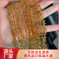 天然の黄水晶の彫刻面の偏平な水滴の透体の濃い色の黄塔の結晶の手の切断面の水滴DIYの装飾品の部品