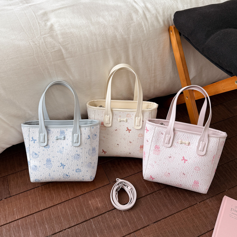 Fresco dulce popular impresión bolsos personalidad extranjera versátil bolsos de mochila de moda diaria bolsos de cubo portátiles