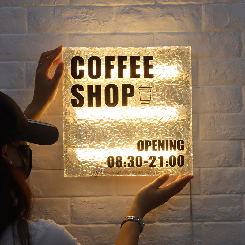 Customized outdoor storefront advertising signs, wall-mounted LED illuminated signs, and acrylic light boxes with stone texture.