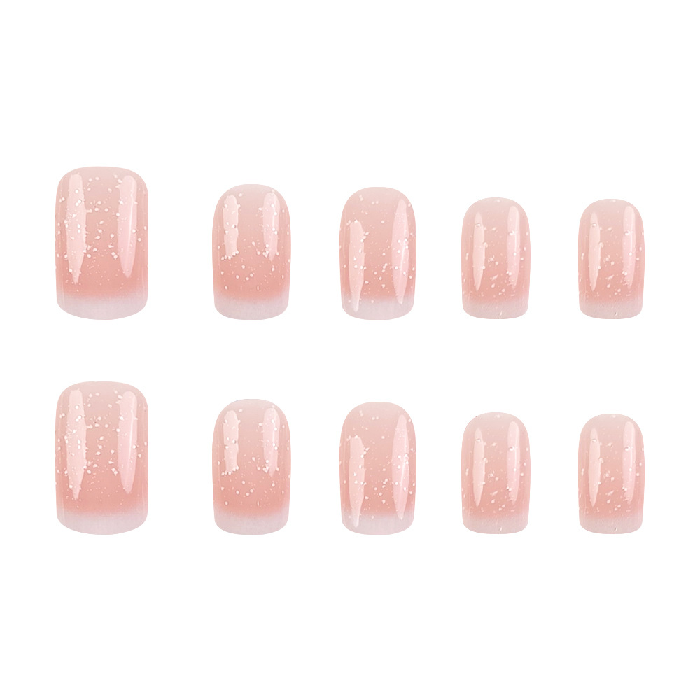 El método de uso de uñas europeas de brillo fino comercio exterior 24 piezas de uñas blanqueadoras suaves en un lote de uñas falsas de viaje