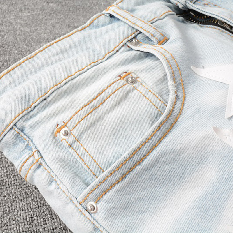 Jean homme slim fit élastique avec trous aux genoux et étoiles_voghion.com