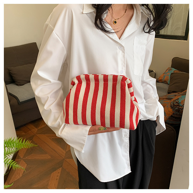New cross-border fashion color-blocking striped cosmetic bag, women's loose change mobile phone storage bag, trendy and niche cloud clutch undefined
