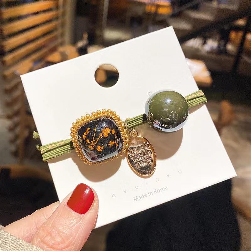 Elástico joyas de cabello de moda con frijoles frescos M anillo de cereza cuerda de cabello al por mayor de la banda de goma cabeza de 100 bolas de cabello rojo una variedad de alta elástica