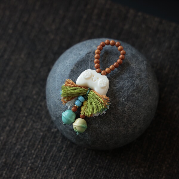 Genuine design pendant with tassels