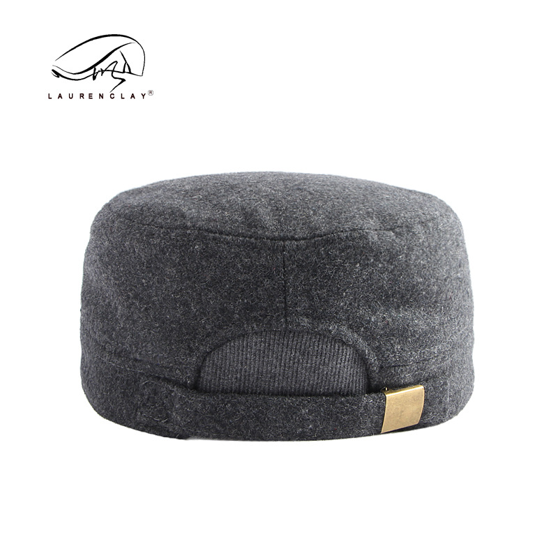 Sombrero al por mayor de los hombres otoño y el invierno lana caliente sellado completo casquillo enarbolado simple luz tablero superior plana azul marino sombrero