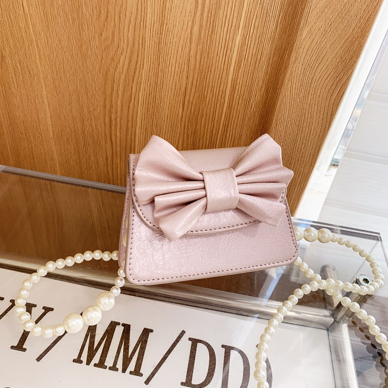 Coreano estilo extranjero mini niñas bolso de hombro lindo arco bebé mochila nueva moda bolso de cadena para niños