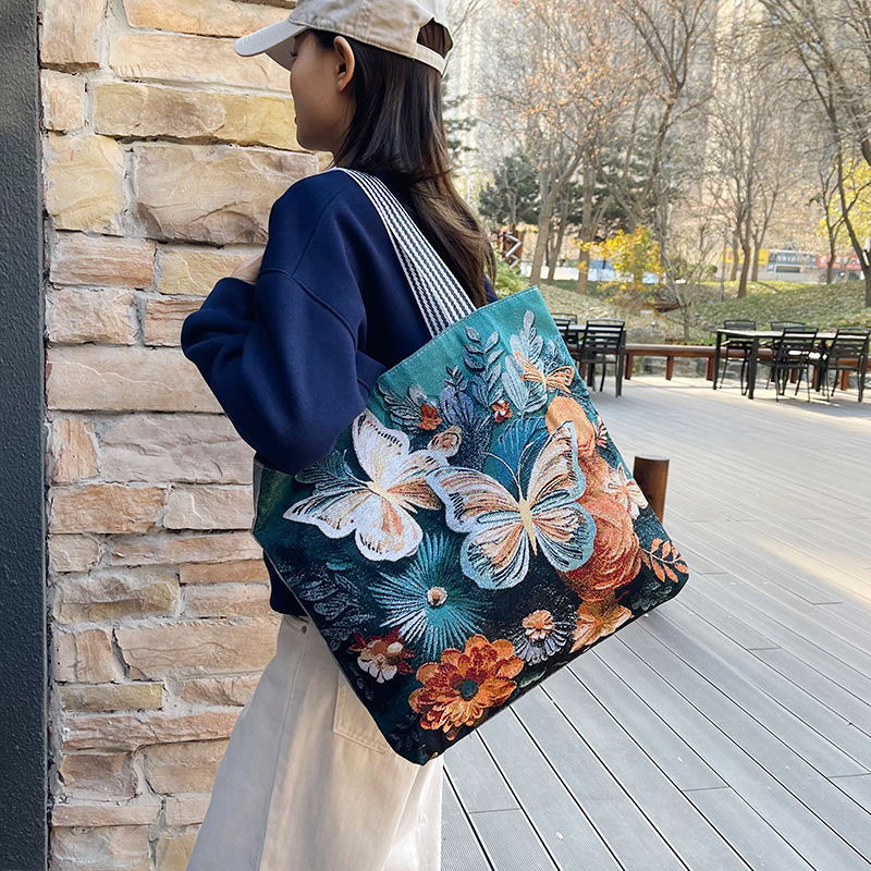 新しい女性のキャンバスポータブルショルダーバッグ漫画蝶織り刺繍シンプルな大容量ショッピングバッグ短距離旅行大型バッグ|undefined
