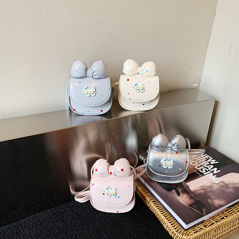 2026 nuevo bolso infantil caricatura perrito lindo arco bolso de cambio de moda punto de onda bolso accesorios de niña pequeña