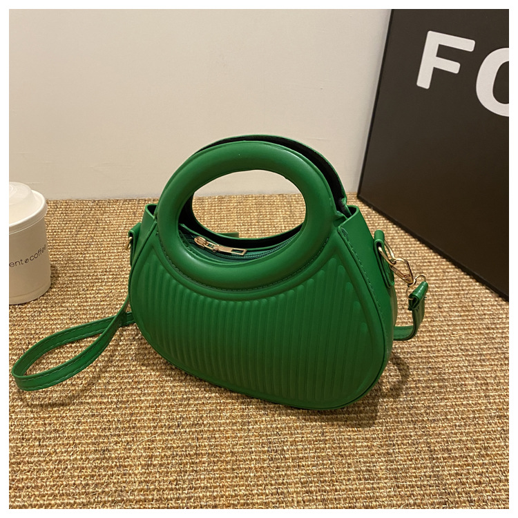Fresco dulce dopamina color sólido rayas bolso de las mujeres este año popular pu estilo occidental bolso de hombro redondo