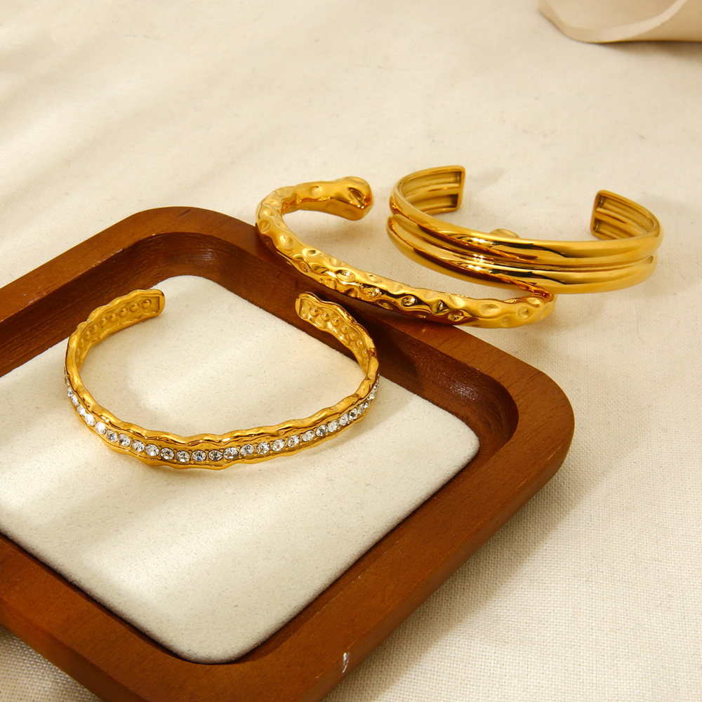 18g Weight 0.03µm-0.05µm Gold Plating Thickness PVD Coated Gold Plating Process 18K Real Gold Plated Plating Material Zircon Inlay Material Bangle Classification 1 Piece Quantity Casual, Holiday, Daily, Street Occasion 304 Stainless Steel Material Geometric Pattern Women's Gender Retro, Classic Style Style Mixed Metal, Plating, Hammered Craft Retro Classic Style Geometric 304 Stainless Steel 18K Gold Plated Bangle In Bulk 16