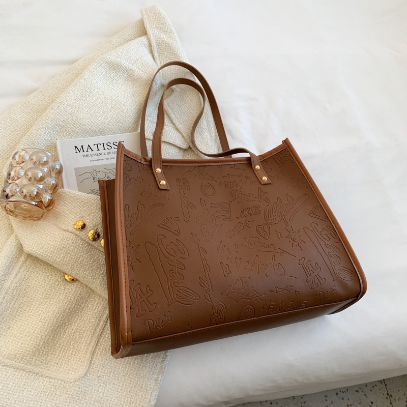 Bolso de mujer 2024 primavera nuevo nicho lienzo de cuatro hojas de gran capacidad bolso de hombro simple bolso de todo tipo