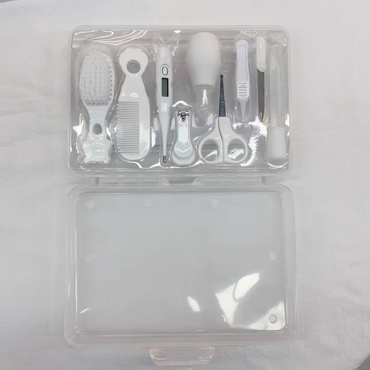 Comercio exterior Juego de cuidado de bebés Cortaúñas para bebés Herramientas de cuidado de cepillos de dientes Peine Cepillo Caja de almacenamiento Juego de 9 piezas image 9