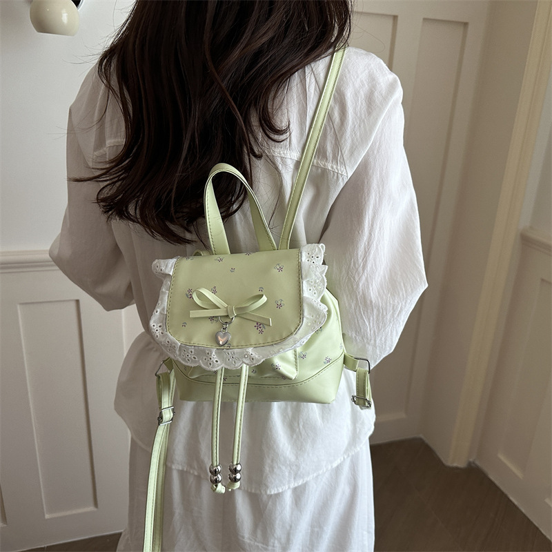 Mochila de flores para mujeres 2026 nueva moda alta sensación de mochila de estilo universitario ultra caliente de moda versátil mochila de viaje