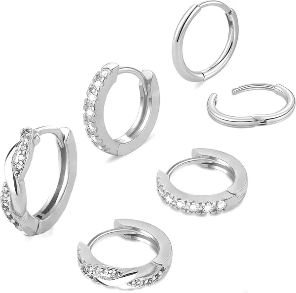 Three pairs of silver set with diamonds