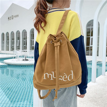 新款韩版字母休闲时尚帆布双肩背包慵懒风简约大容量抽带水桶包