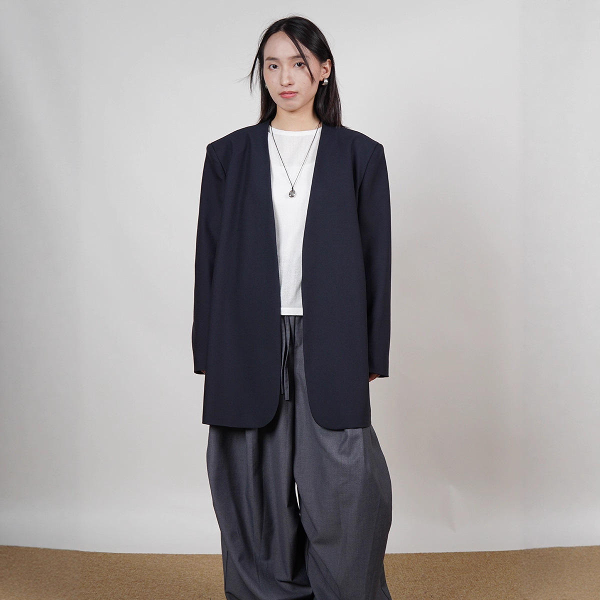 25 Elegant and Relaxed Wool Suit Without Collar, with a Luxurious and Understated Style, Slimming Silhouette, Shoulder Pads, Commuter Jacket