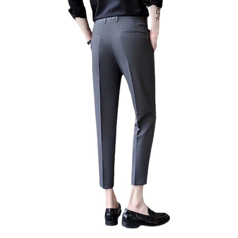 Verano nuevo estilo pantalones recortados pantalones de traje pequeño de moda para hombres drapeado sin planchar pantalones cónicos ins jóvenes pantalones casuales de moda