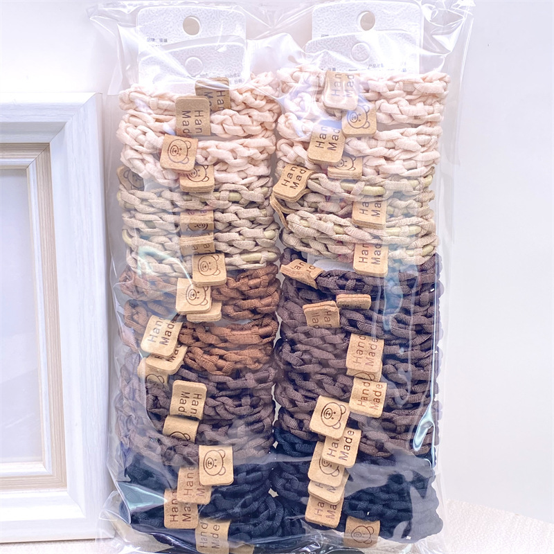 Traje de tarjeta cara sonriente oso etiqueta de cuero leche té color Banda para el cabello corbata de pelo de las mujeres banda de goma supermercado 2 yuanes tienda física accesorios para el cabello