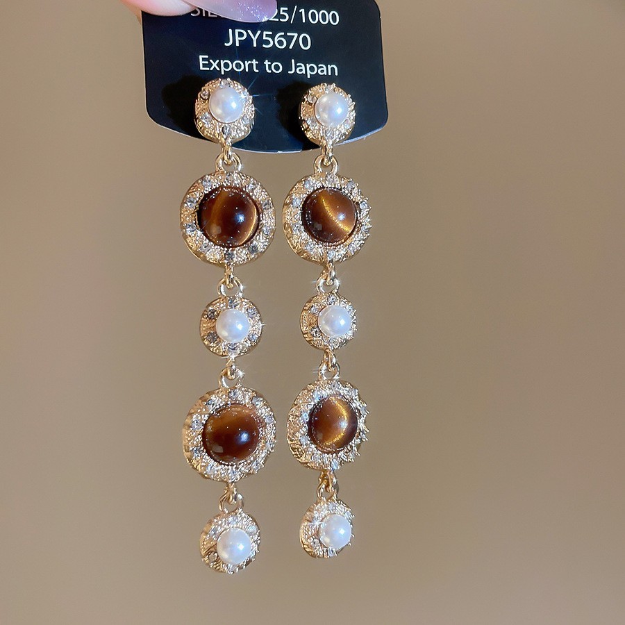 Pendientes de ojo de tigre artificial de color café Maillard con aguja de plata Pendientes simples y de moda de todo fósforo Pendientes ligeros de lujo de alta gama