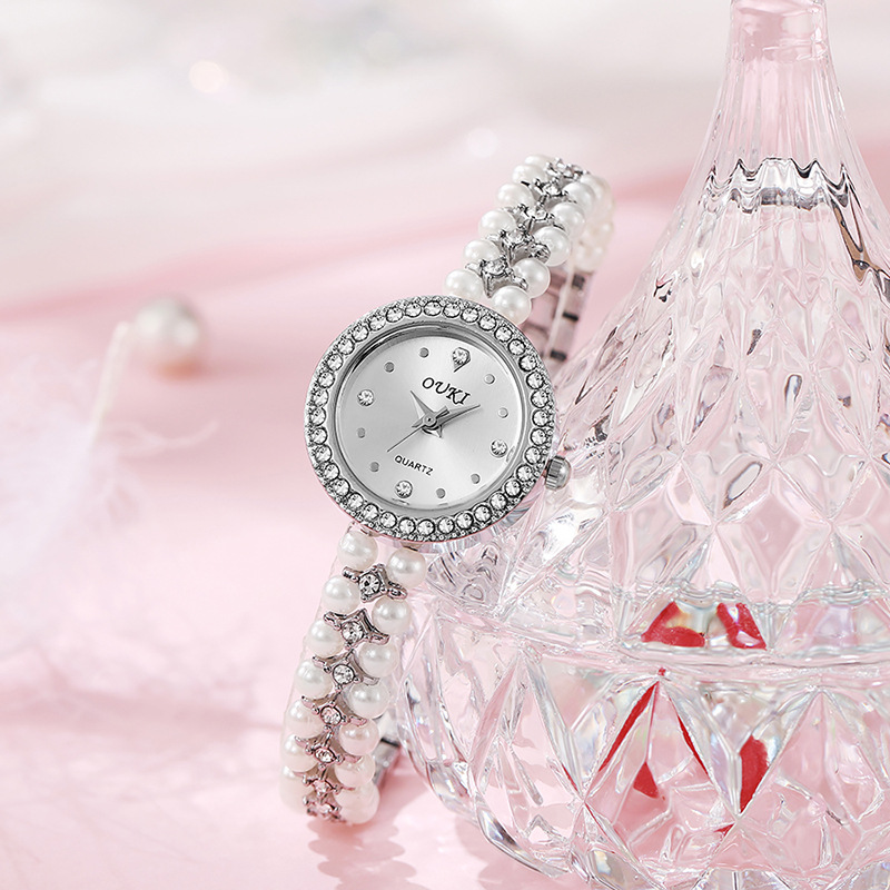 Reloj de pulsera de perlas con cara de gota de agua redonda de lujo ligero transfronterizo moda hecha a mano con cuentas regalo temperamento reloj de mujer al por mayor