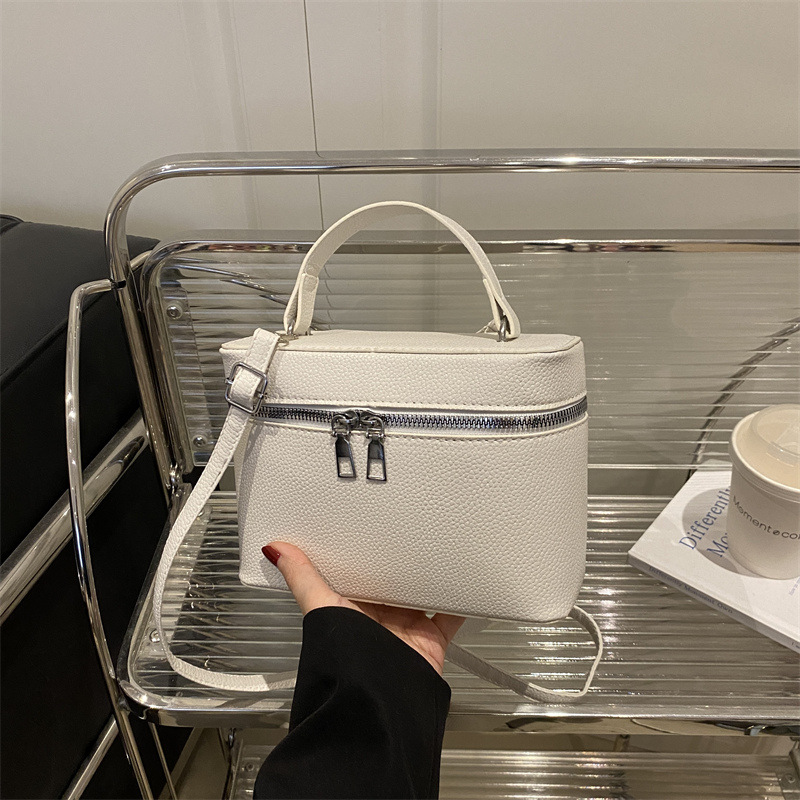 Bolsos para mujer nuevo estilo 2025 primavera nicho todo-fósforo bolso de mensajero de moda de hombro patrón de lichi bolso de cubo de lujo ligero