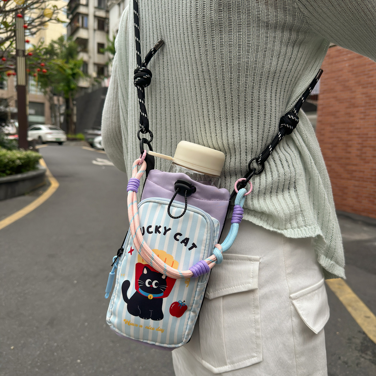 Botella de agua Teléfono móvil Xiaodance Cool nuevo bolso de cinturón bolso de dibujos animados bolso de cinturón portátil de viento ligero bolso de mujer 2026 paquete multifuncional