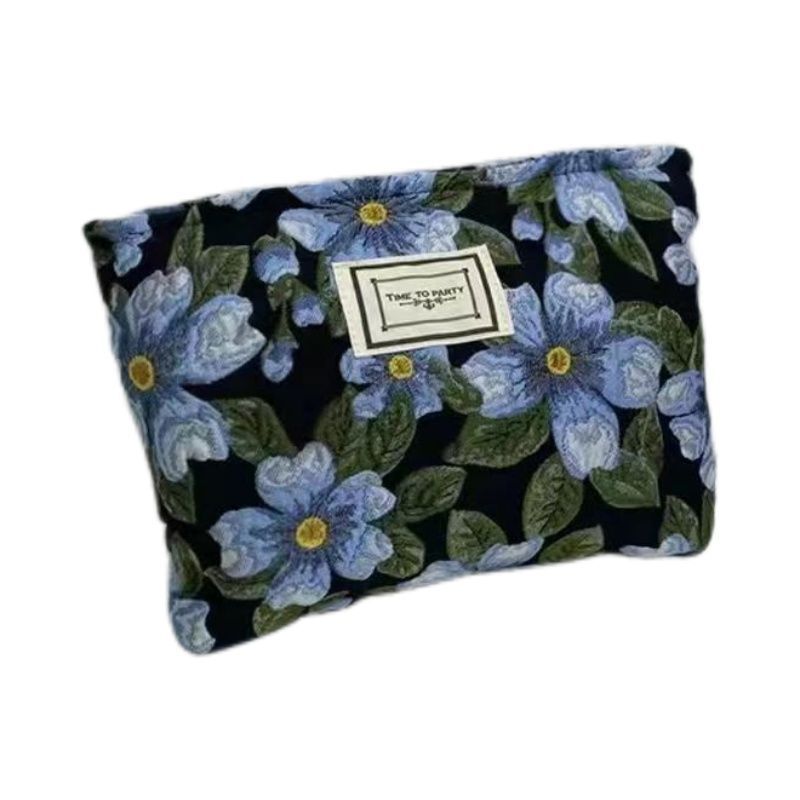 Diseño original de nicho blanco y negro temperamento Jacquard lienzo maquillaje bolsas de mano estilo retro simple flores convenientes