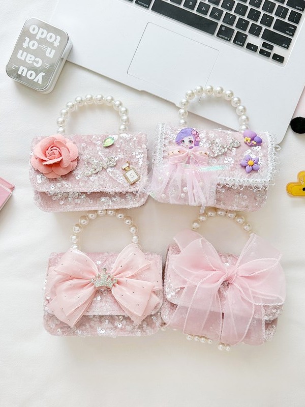 Primavera y verano nuevos bolsos infantiles, bolsos de perlas de arco, bolsos de mano, princesa de estilo extranjero, bolsos de cambio de hombro