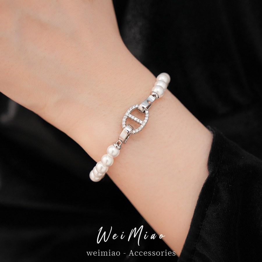 Pulsera de perla de nariz de cerdo de piedra de diamante redonda, pulsera ligera y lujosa, pulsera de nicho, joyas de moda versátiles.