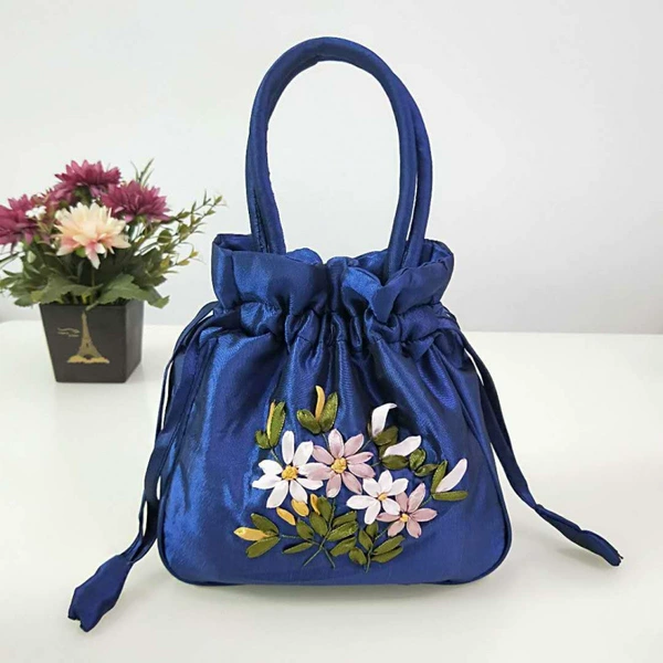 Bald blue pumping stroke embroidered bag