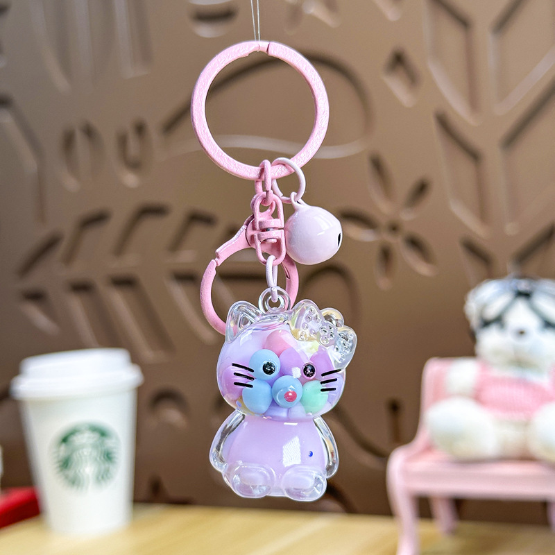 Caricatura en aceite líquido arena flotante botella mochila llavero delicado colgante accesorios accesorios máquina de muñecas pequeños regalos al por mayor