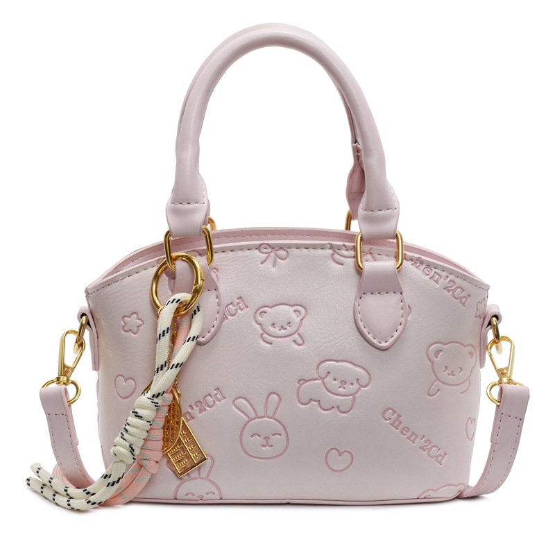 Tendencia nicho bolso de mano de moda mujer 2025 nueva textura versátil bolso de cubo bolso de transporte aéreo