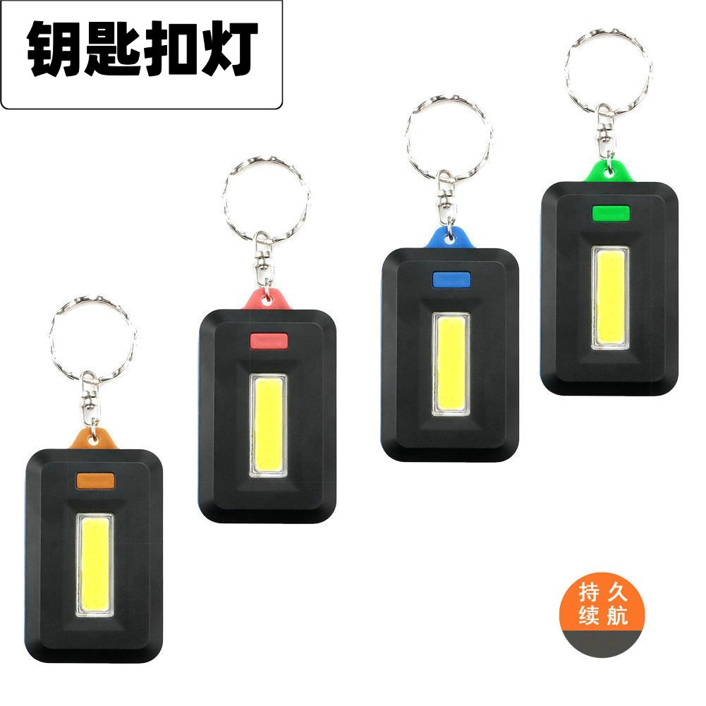 Luz de llavero COB transfronteriza AAA batería seca mini luz de mochila luz de trabajo de emergencia para el hogar pequeño regalo al por mayor